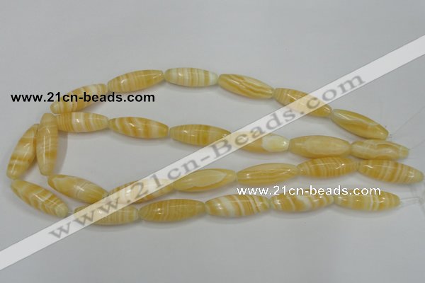 CCA209 15.5 inches 10*30mm rice yellow lace calcite beads