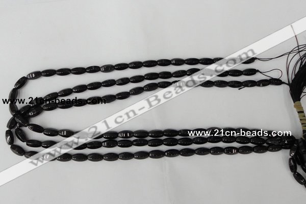 CTO116 15.5 inches 5*10mm faceted rice black tourmaline beads