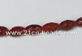 CAA124 15.5 inches 6*10mm faceted rice red agate gemstone beads