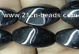 CAA2482 15.5 inches 6*12mm twisted rice black agate beads