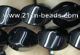 CAA2485 15.5 inches 8*12mm twisted rice black agate beads