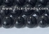 CAA3660 15.5 inches 6mm round matte & carved black agate beads