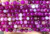 CAA6325 15 inches 6mm faceted round fuchsia banded agate beads