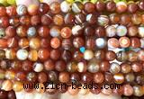 CAA6330 15 inches 6mm faceted round red banded agate beads