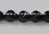 CAB336 15.5 inches 10*14mm faceted & twisted rice black agate beads