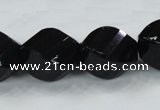 CAB338 15.5 inches 18*24mm faceted & twisted rice black agate beads