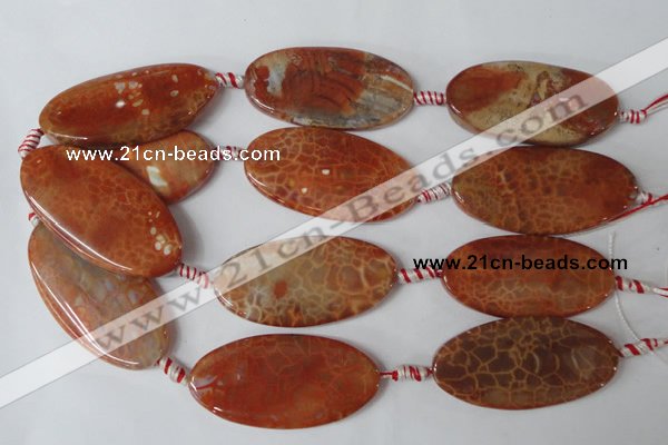 CAG1592 15.5 inches 25*50mm twisted oval fire crackle agate beads