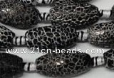 CAG2295 15.5 inches 13*25mm faceted rice fire crackle agate beads