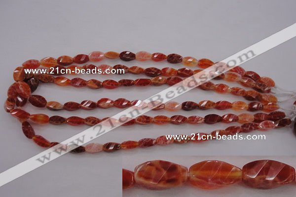 CAG4180 15.5 inches 6*12mm faceted & twisted rice natural fire agate beads