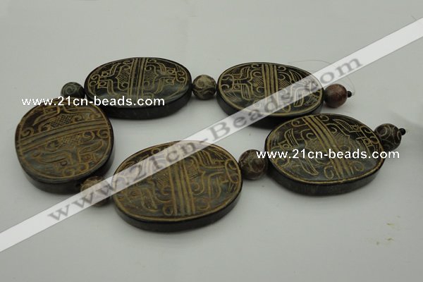 CAL22 14.5 inches 47*60mm carved oval agalmatolite beads