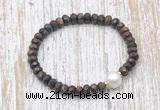 CFB754 faceted rondelle bronzite & potato white freshwater pearl stretchy bracelet