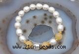 CFB928 9mm - 10mm rice white freshwater pearl & honey jade stretchy bracelet
