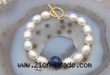 CFB980 Hand-knotted 9mm - 10mm rice white freshwater pearl & blue tiger eye bracelet