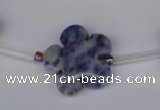 CFG1006 15.5 inches 20mm carved flower blue spot stone beads