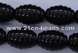 CFG759 15.5 inches 15*20mm carved rice black agate beads