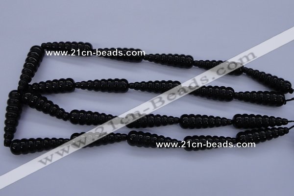 CFG761 15.5 inches 10*35mm carved teardrop black agate beads