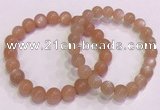 CGB4587 7.5 inches 8mm - 9mm round sunstone beaded bracelets