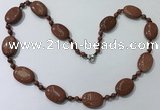 CGN201 22 inches 6mm round & 18*25mm oval goldstone necklaces