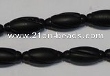 CNE15 15.5 inches 9*20mm carved rice black stone needle beads wholesale