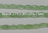 CRU165 15.5 inches 5*8mm faceted rice green rutilated quartz beads