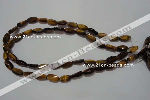 CTE1097 15.5 inches 8*15mm twisted & faceted oval yellow tiger eye beads