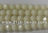 CTU1440 15.5 inches 4mm faceted round synthetic turquoise beads