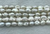 FWP351 15 inches 8mm - 9mm baroque white freshwater pearl strands